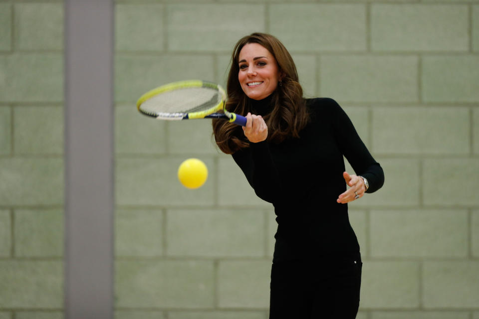 Kate joins in with a tennis coaching session (PA)