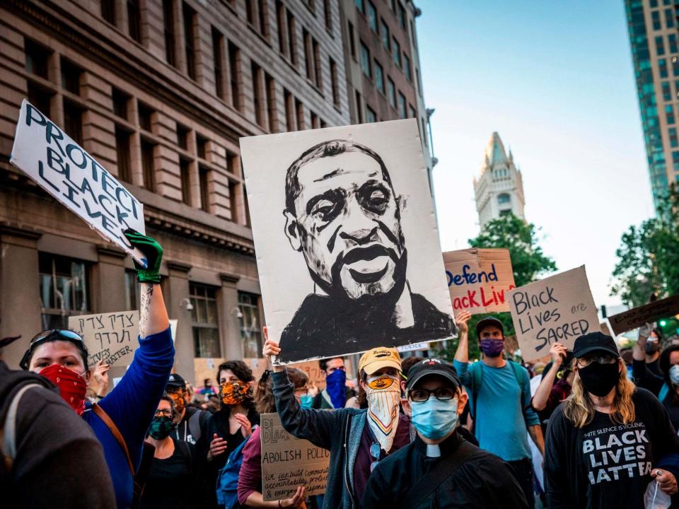 Demonstrators attend a 'Sit Out the Curfew' protest against the death of George Floyd, who died on 25 May in Minneapolis while in police custody, along a street in Oakland, California, on 3 June 2020: Philip Pacheco/AFP/Getty