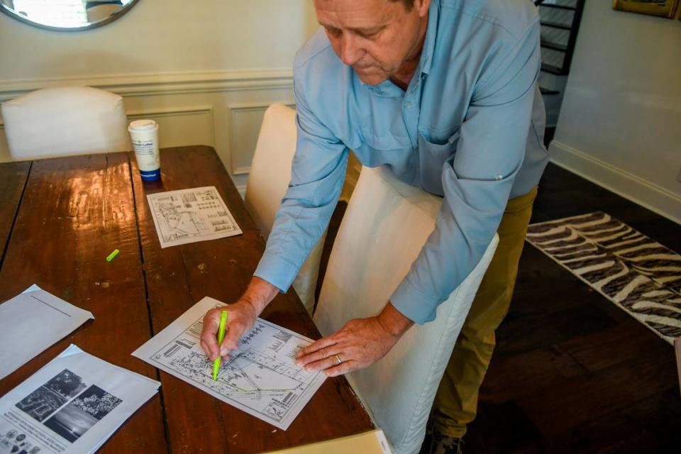 Charlie Calvert, a resident of Pinckney Retreat, uses a marker to highlight the Cherry Hill Plantation parcel at his home on Sept. 21, 2022 in in the Town of Port Royal. Developers sought to build a massive complex of townhomes and aprtments that could imperil a massive live oak tree estimated to be more than 300 years old as well as at least one grave, marked with a headstone by its base.