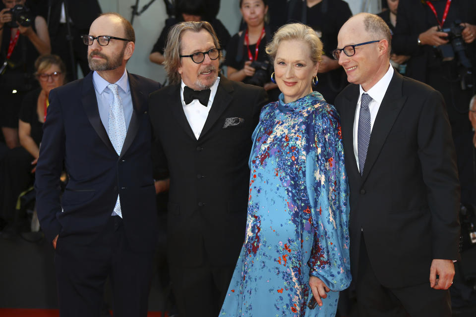 FILE - This Sept. 1, 2019 file photo shows director Steven Soderbergh, from left, actors Gary Oldman, Meryl Streep and author Jake Bernstein at the premiere of the film 'The Laundromat' at the 76th edition of the Venice Film Festival, Venice, Italy. The film will be released in U.S. theaters on Sept. 27. (Photo by Joel C Ryan/Invision/AP, File)