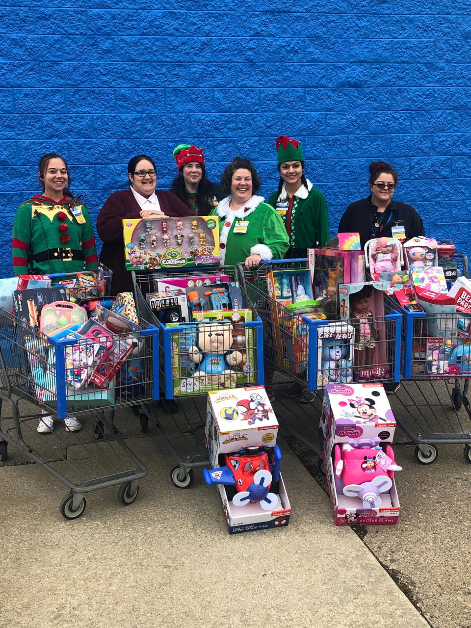 Alliance Walmart employees bought, then donated four shopping carts full of toys to the Salvation Army in Alliance for Christmas.