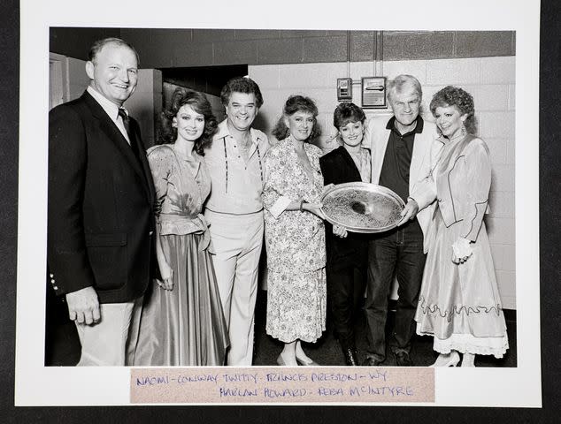 <p>courtesy of the Naomi Judd Estate</p> From left to right: Roger Sovine, Naomi Judd, Conway Twitty, Francis Preston, Wynonna Judd, Harlan Howard, and Reba McEntire, 1985