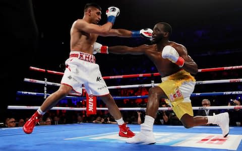 Terence Crawford and Amir Khan in action - Credit: ANDREW COULDRIDGE/Reuters