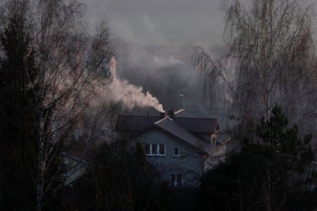 FILE PHOTO: Smoke rising from a family house in Bedzin, near Katowice, Poland, December 5, 2018. REUTERS/Kacper Pempel