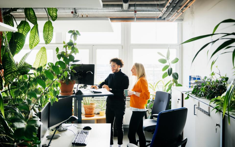 More companies are now providing standing desks so you can add more movement to your day - Digital Vision