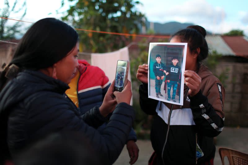 Family and friends gather to mourn the dead of their loved ones who died in the U.S., in Nahuala