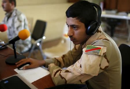 An Iraqi soldier works at a radio station at Makhmour base, Iraq, April 17, 2016. REUTERS/Ahmed Jadallah/File Photo