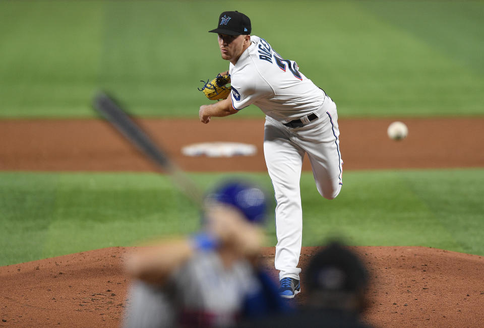 Miami Marlins starting pitcher Trevor Rogers delivers a pitch to New York Mets' Tim Locastro during the second inning of a baseball game, Sunday, April 2, 2023, in Miami. (AP Photo/Michael Laughlin)