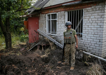 Ukrainian serviceman is seen at his position on the front line near Avdeyevka, Ukraine, August 10, 2016. REUTERS/Gleb Garanich