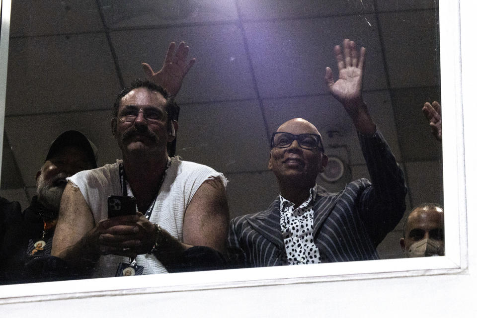 the two watching an event from a private box