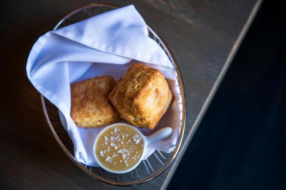 Homemade biscuits with honey butter at Olamaie in 2018.