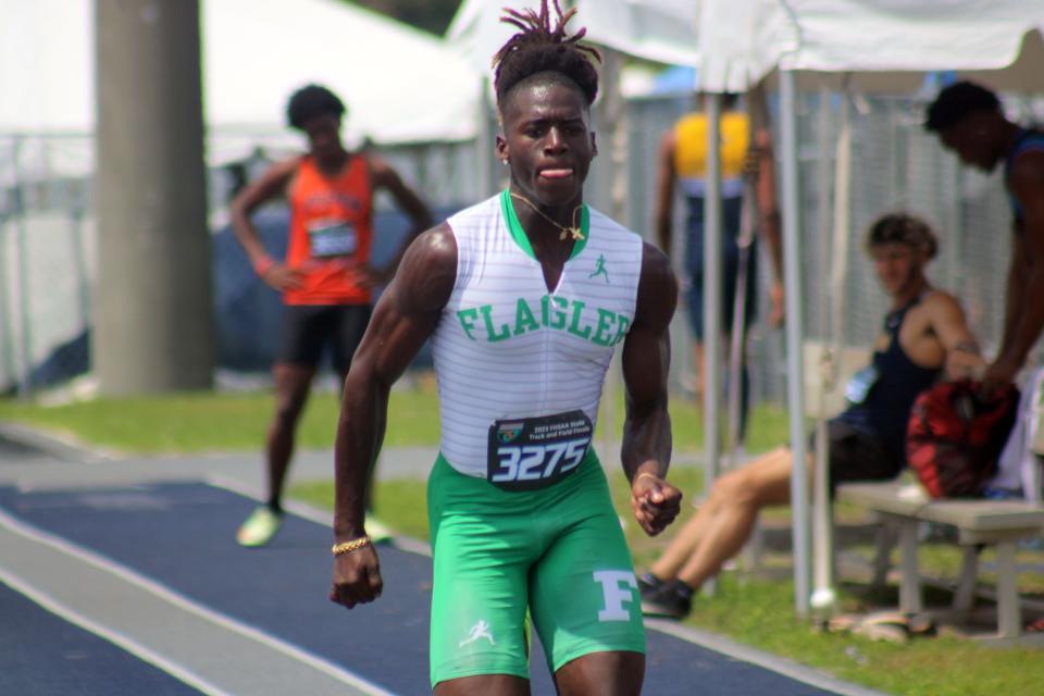 Gerod Tolbert of Flagler Palm Coast races along the runway in the boys long jump  at the FHSAA Class 4A high school track and field state championship in Jacksonville on May 20, 2023. [Clayton Freeman/Florida Times-Union]