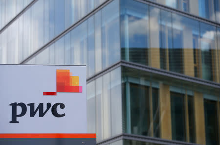 FILE PHOTO: The logo of PricewaterhouseCoopers is seen in front of the local offices building of the company in Luxembourg, April 26, 2016. REUTERS/Vincent Kessler