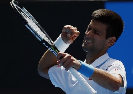 Novak Djokovic of Serbia celebrates after defeating Andrey Kuznetsov of Russia in their men's singles second round match at the Australian Open 2015 tennis tournament in Melbourne January 22, 2015. REUTERS/Issei Kato