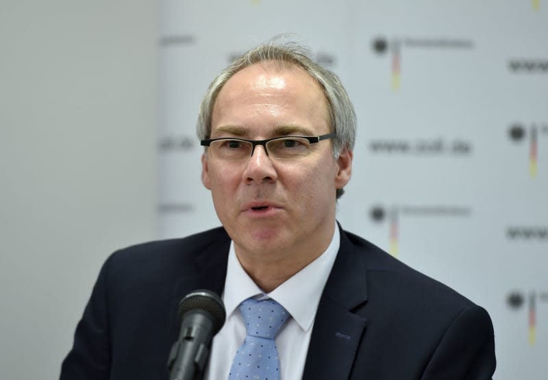 Wolf-Tilman Baumert from the Wuppertal public prosecutor's office speaks at a press conference about the success of the raid. German police have seized numerous weapons and ammunition belonging to a man linked to the Reichsbürger or "Reich Citizens" coup movement. Caroline Seidel/dpa