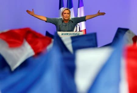 Marine Le Pen, French National Front (FN) political party leader, gestures during an FN political rally in Frejus, France, September 18, 2016. REUTERS/Jean-Paul Pelissier/Files