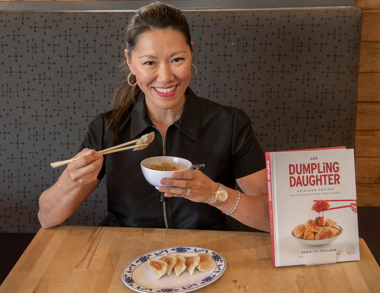 Nadia Liu Spellman, founder of Dumpling Daughter, samples a dish inside her Weston restaurant, May 7, 2024.