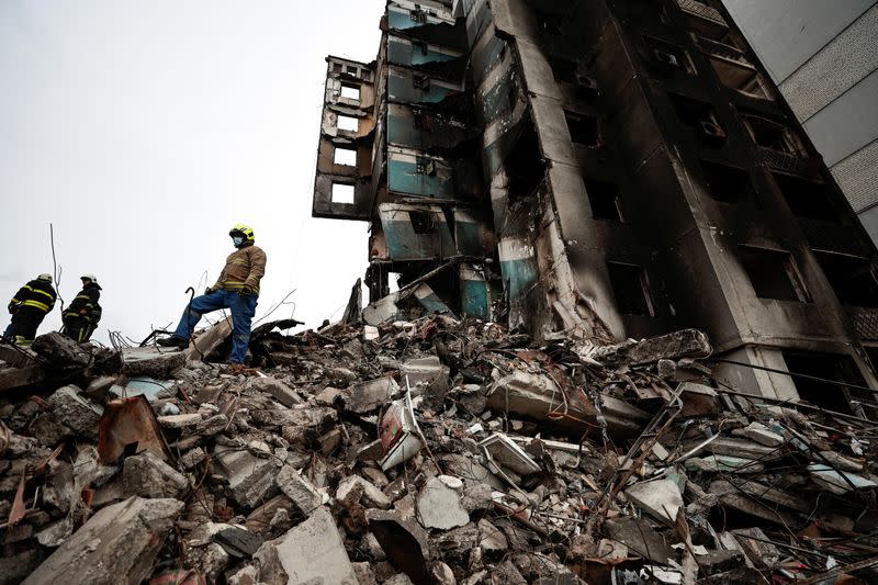 Search for bodies under the rubble of a building destroyed by Russian shelling, in Borodyanka