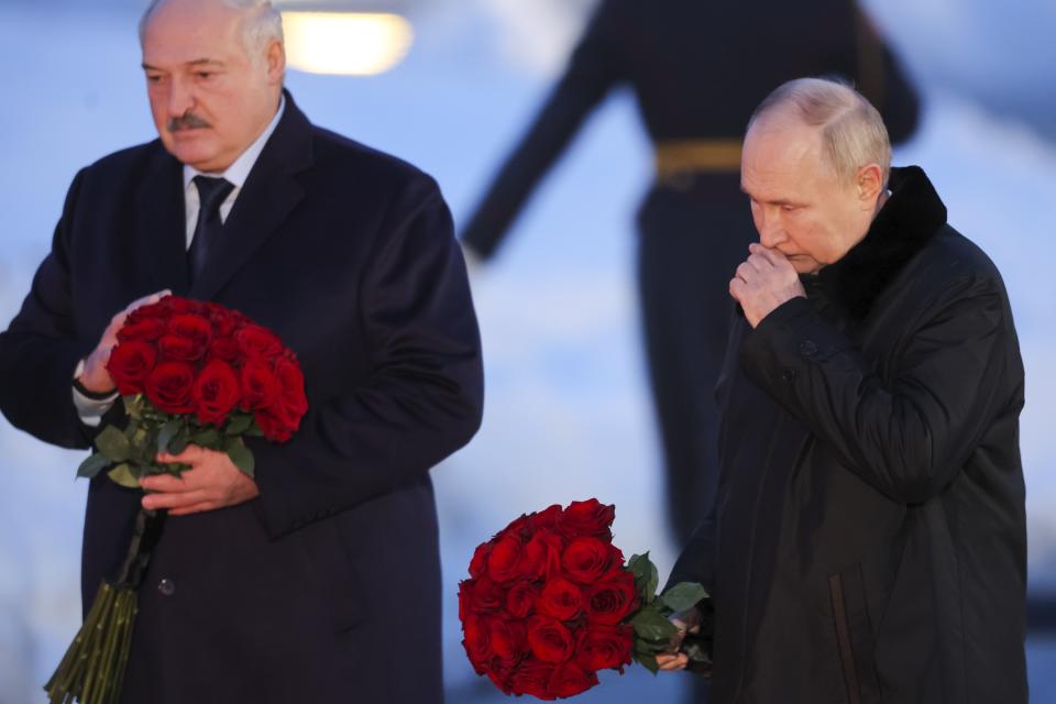 Russian President Vladimir Putin, right, and Belarusian President Alexander Lukashenko attend the opening ceremony of the memorial complex "To the peaceful citizens of the Soviet Union who died during the Great Patriotic War", WWII, near Zaitsevo village in the Leningrad Region, Russia, Saturday, Jan. 27, 2024. The ceremony marked the 80th anniversary of the battle that lifted the Siege of Leningrad. The Nazi siege of Leningrad, now named St. Petersburg, was fully lifted by the Red Army on Jan. 27, 1944. More than 1 million people died mainly from starvation during the nearly 900-day siege. (Anton Vaganov/Pool Photo via AP)