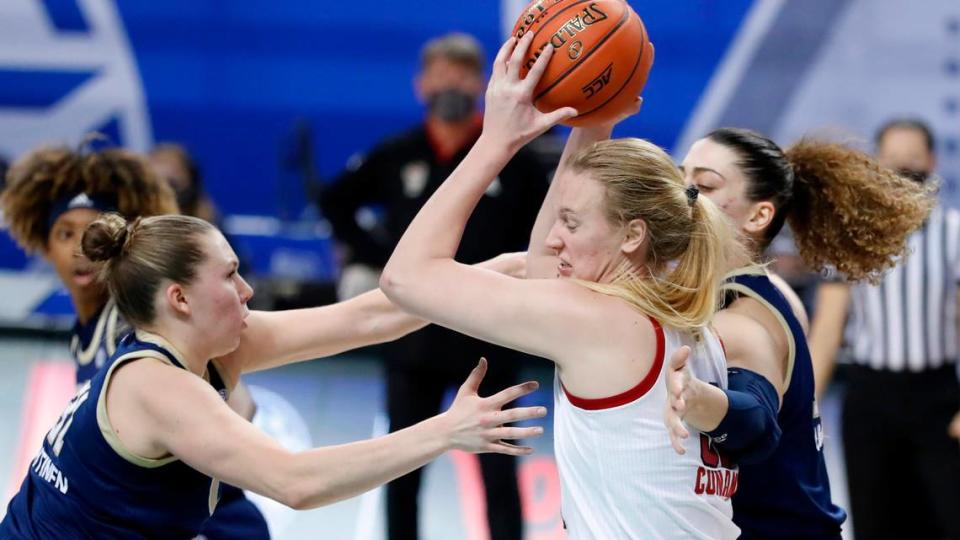 Georgia Tech’s Lotta-Maj Lahtinen (31), left, and Lorela Cubaj (13) pressure N.C. State’s Elissa Cunane (33) during the second half of N.C. State’s game against Georgia Tech in the semifinals of the ACC Women’s Basketball Tournament in Greensboro, N.C., Saturday, March 6, 2021.