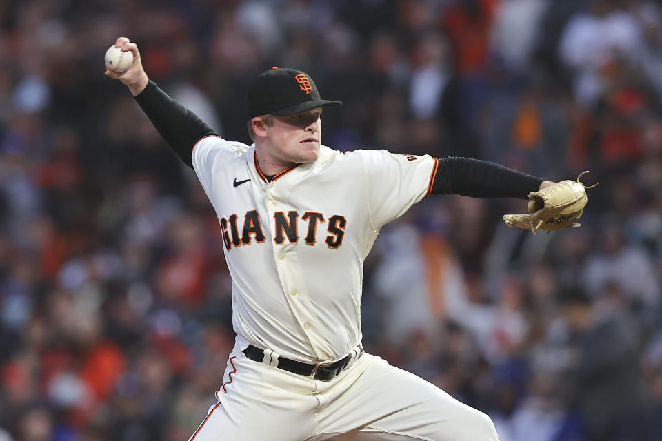 San Francisco Giants' Logan Webb pitches against the Los Angeles Dodgers during the first inning of Game 1 of a baseball National League Division Series Friday, Oct. 8, 2021, in San Francisco. (AP Photo/John Hefti)