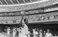 Hank Aaron of the Atlanta Braves reacts Saturday, July 21, 1973, in Atlanta after hitting 700th career home run against the Philadelphia Phillies. (AP Photo)