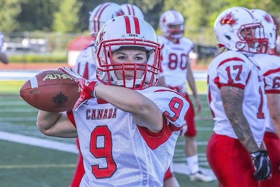 In this 2017 photo provided by Amanda Ruller, Ruller is shown playing football for Team Canada. Ruller is currently working as an assistant running backs coach for the NFL football Seattle Seahawks through the league's Bill Walsh Diversity Fellowship program, a job that is scheduled to run through the Seahawks' second preseason game in August. (Debra Carlsen/via AP)