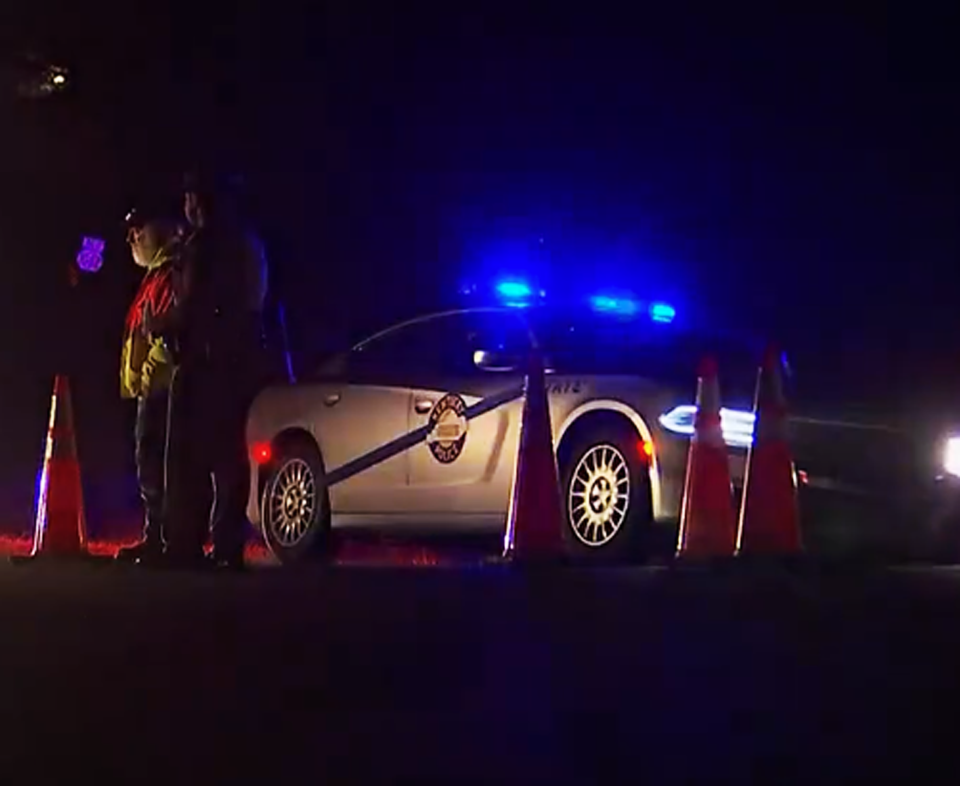 Officers guard the scene of a fatal Blackhawk helicopter crash in Trigg County, Ky., on March 29, 2023.  (via WSMV)