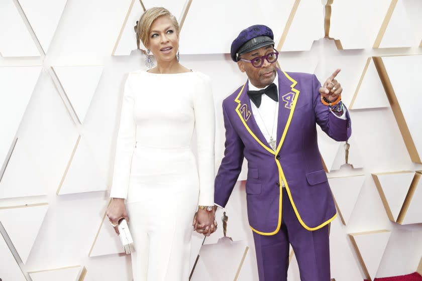Tonya Lewis Lee, left, and husband Spike Lee arrive at the 92nd Academy Awards. The “BlacKkKlansman” director wore a custom Gucci suit that paid tribute to Lakers legend Kobe Bryant, who died last month in a helicopter crash.(Jay L. Clendenin / Los Angeles Times)