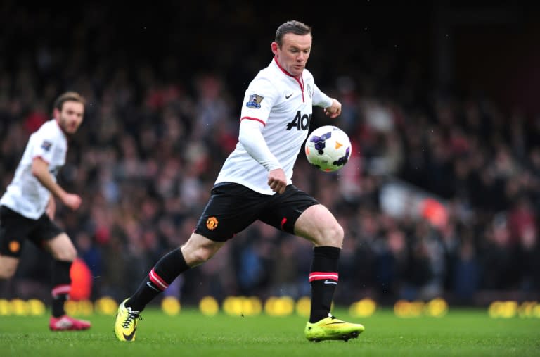 Striker Wayne Rooney scored the opening goal during the English Premier League football match against West Ham United at the Boleyn Ground, Upton Park, in London on March 22, 2014