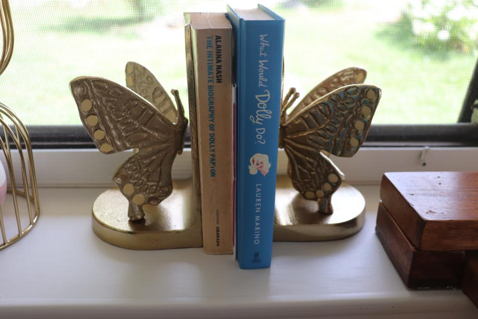 Butterfly book holders in a Dolly Parton-themed RV