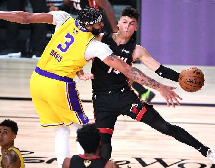 ORLANDO, FLORIDA SEPTEMBER 30, 2020-Lakers Anthoiny Davis forces Heat's Tyler Herro.