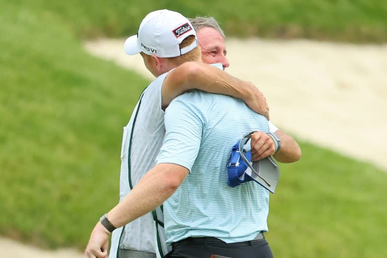Hayden Springer (right) celebrates with his caddie after a last-hole birdie saw him complete a 59 at the John Deere Classic in Illinois on Thursday (Stacy Revere)