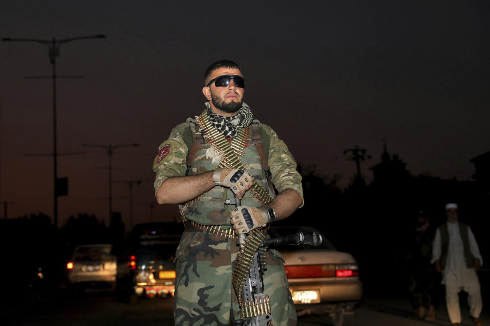 In this Tuesday, Sept. 24, 2019 photo, an Afghan National Army soldiers stands guard at a checkpoint ahead of presidential elections scheduled for Sept. 28, in Kabul, Afghanistan. Facing down Taliban threats Afghans are torn between fear, frustration and sense of duty as they decide whether to go to the polls Saturday to choose a new president. But the security preparations have been elaborate. (AP Photo/Ebrahim Noroozi)