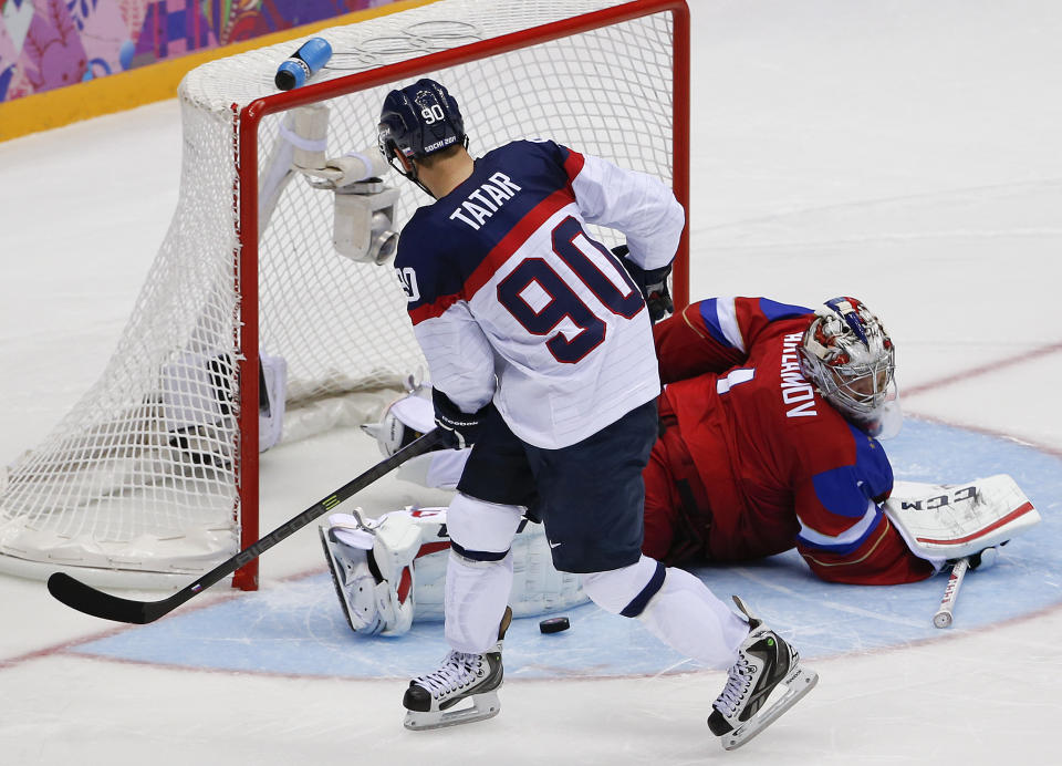 Russia goaltender Semyon Varlamov blocks a shot by Slovakia forward Tomas Tatar in a shootout of a men's ice hockey game at the 2014 Winter Olympics, Sunday, Feb. 16, 2014, in Sochi, Russia. Russia won 1-0. (AP Photo/Julio Cortez)