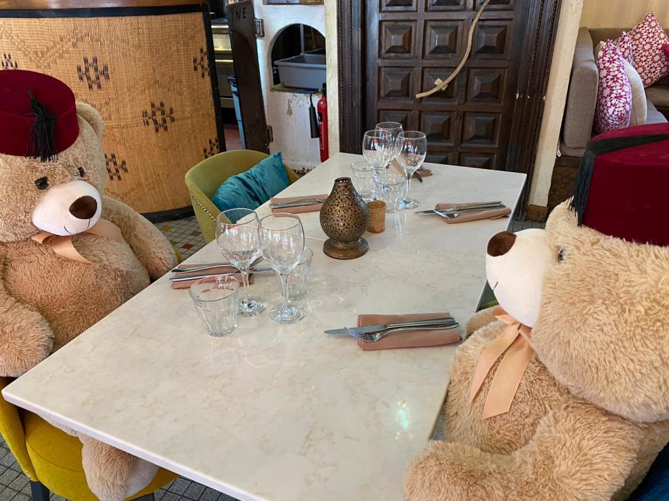 Cuddly toy bears sit in seats at Tagine in Balham to enforce social distancing at the restaurant