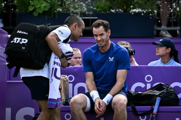 Andy Murray (R) was forced to retire against Jordan Thompson at Queen's after a medical time-out (Ben Stansall)