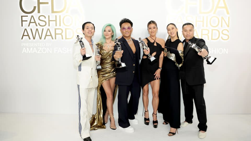 Phillip Lim (far right) poses with Ezra J. William, Tina Leung, Prabal Gurung and Laura Kim — founders of the "House of Slay" — as the winners of the Positive Social Influence Award at the CFDA Fashion Awards on November 7, 2022 in New York City. The House of Slay was formed to combat anti-Asian discrimination and hate, but also represents other marginalized communities and peoples, working to take on racism, hatred, bullying and fear of the 'other.'" (Also pictured is Eva Chen, second from right, who presented the award.) - Dimitrios Kambouris/Getty Images
