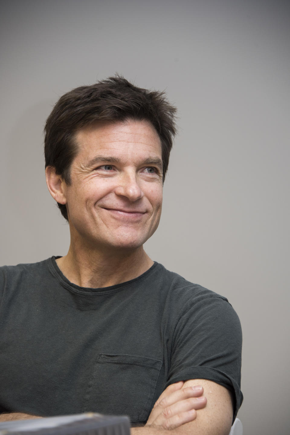 Bateman looks off-camera