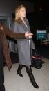 <p>Kate Hudson is prepared for New York City's winter chill as she departs from JFK in a grey overcoat in November 2007. </p>