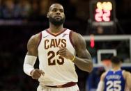 Nov 27, 2017; Philadelphia, PA, USA; Cleveland Cavaliers forward LeBron James (23) runs up court in front of Philadelphia 76ers guard Ben Simmons (25) at Wells Fargo Center. Mandatory Credit: Bill Streicher-USA TODAY Sports