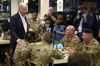 U.S. President Joe Biden, left, meets with American service members and their family at Osan Air Base, Sunday, May 22, 2022, in Pyeongtaek, South Korea. (AP Photo/Evan Vucci)
