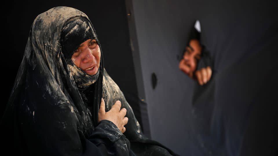 An Iraqi woman cries as Shiites reenact the Battle of Karbala in Sadr City, Baghdad. - Ahmad Al-Rubaye/AFP/Getty Images