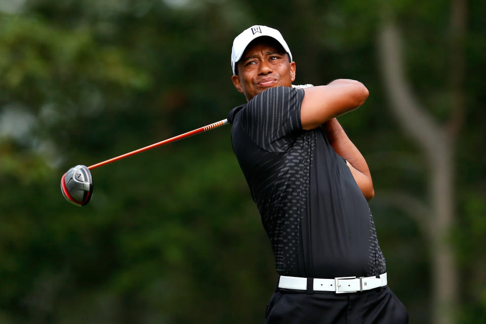 FARMINGDALE, NY - AUGUST 23: Tiger Woods watches his tee shot on the 16th hole during the First Round of The Barclays on the Black Course at Bethpage State Park August 23, 2012 in Farmingdale, New York. (Photo by Kevin C. Cox/Getty Images)