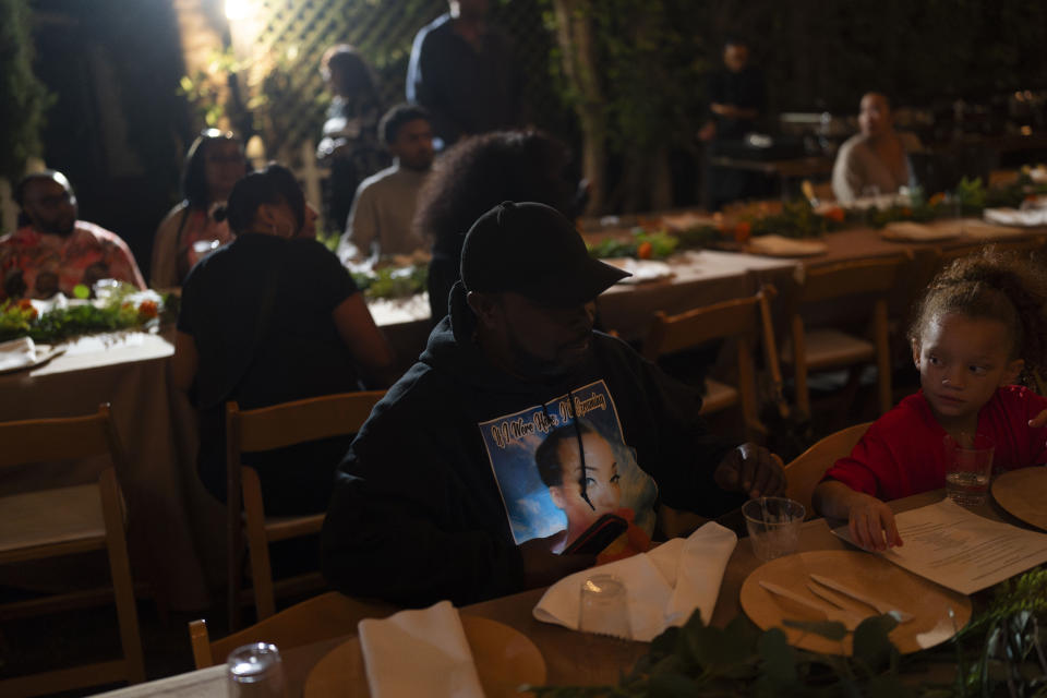 Anthony Day, wearing a hoodie commemorating Korryn Gaines, attends a welcome dinner for the annual Families United 4 Justice Network Conference, hosted by the Black Lives Matter Global Network Foundation at its mansion in the Studio City neighborhood of Los Angeles, Thursday, Sept. 28, 2023. Gaines was fatally shot by a Baltimore County police officer in 2016. (AP Photo/Jae C. Hong)