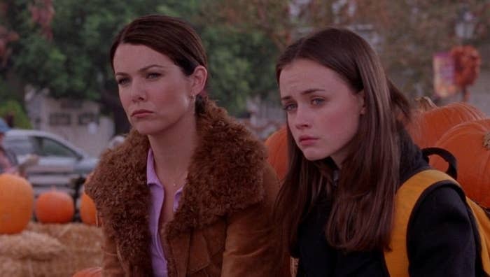 Rory and Lorelai sitting amongst the pumpkins