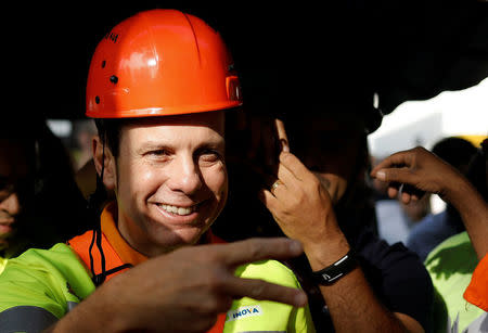 Sao Paulo's Mayor Joao Doria wears a Municipal worker's uniform as he attends the "Pretty City" campaign in Sao Paulo, Brazil, March 25, 2017. REUTERS/Nacho Doce