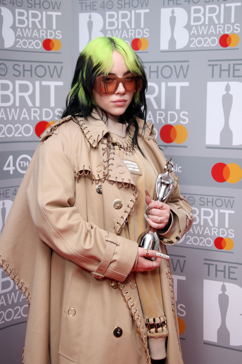 LONDON, ENGLAND - FEBRUARY 18: (EDITORIAL USE ONLY) Billie Eilish poses with the International Female Solo Artist award  in the winners rooms at The BRIT Awards 2020 at The O2 Arena on February 18, 2020 in London, England. (Photo by Mike Marsland/WireImage)