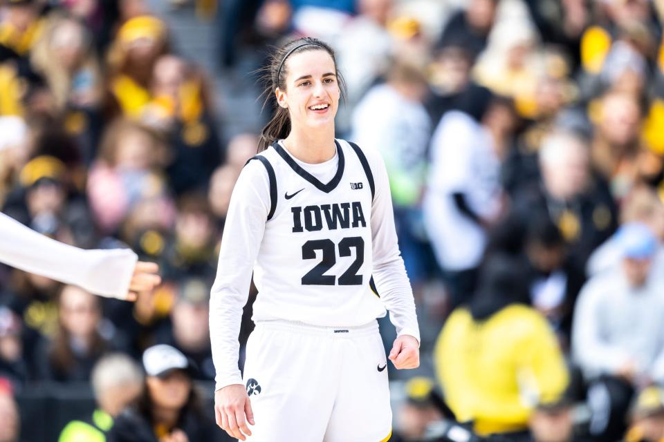 Iowa guard Caitlin Clark (22) smiles during the Crossover at Kinnick women's basketball scrimmage between Iowa and DePaul, Sunday, Oct. 15, 2023, at Kinnick Stadium in Iowa City, Iowa.