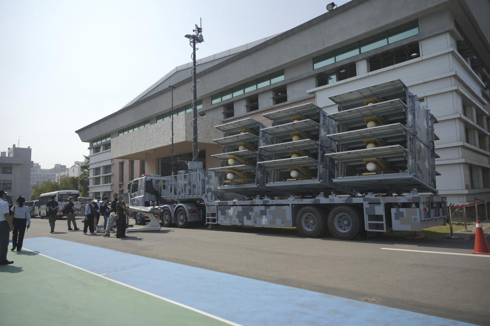 Members of the media look at the Chien Hsiang anti radiation loitering munition launcher at the National Chung-Shan Institute of Science and Technology in Taichung in central Taiwan on Tuesday, Nov. 15, 2022. Taiwan displayed its self-developed drone technology Tuesday, amid rising concerns over China's threats to use force to assert its claim to the self-governing island republic. (AP Photo/Walid Berrazeg)